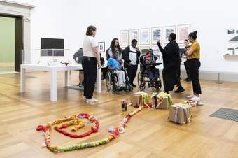 A SEND school group exploring the Tate Britain collection as part of a tailored workshop led by an artist