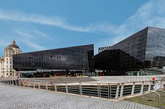 Two modern black buildings and the word 'Discover' written above the door.